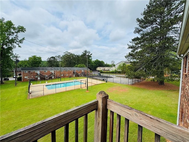 view of yard featuring a fenced in pool and fence