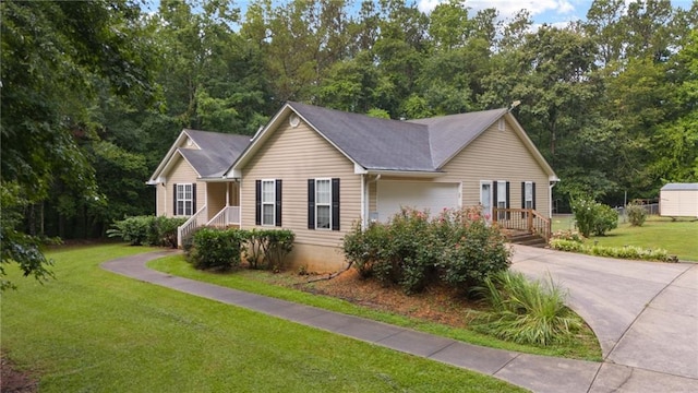 view of front of house featuring a garage and a front yard