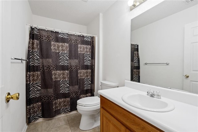 bathroom featuring vanity, a textured ceiling, a shower with curtain, tile patterned floors, and toilet