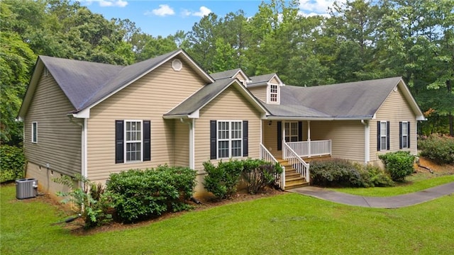 view of front of house featuring cooling unit, covered porch, and a front yard