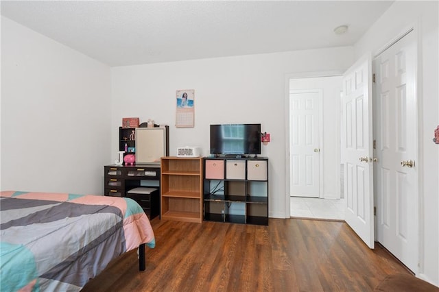 bedroom featuring dark wood-type flooring