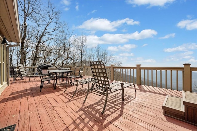 wooden deck with outdoor dining space