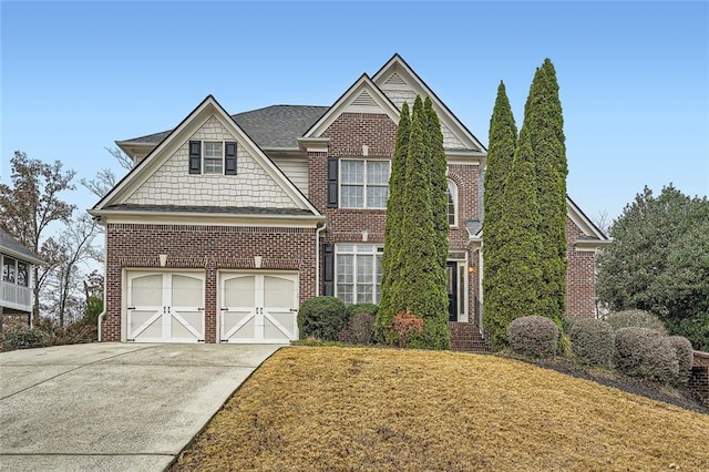 view of front of house with a front yard and a garage