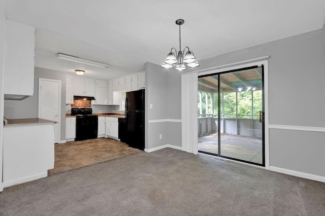 kitchen featuring carpet floors, white cabinets, baseboards, black appliances, and a notable chandelier