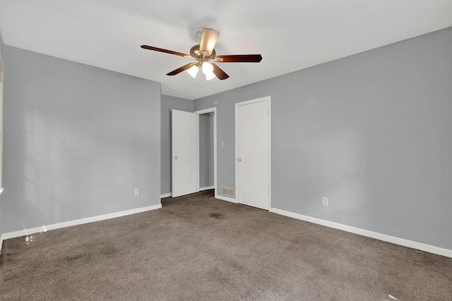 unfurnished bedroom with carpet floors, baseboards, and ceiling fan