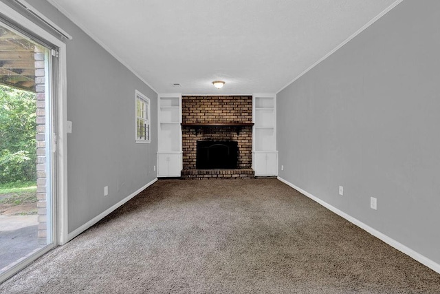 unfurnished living room featuring crown molding, carpet flooring, and built in features