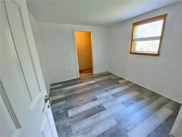 bathroom featuring wood walls, hardwood / wood-style floors, and wood ceiling