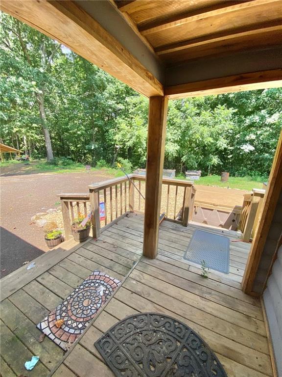 view of yard with a swimming pool side deck