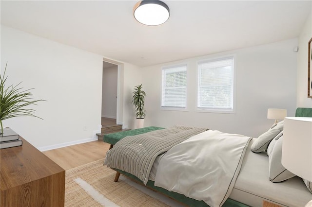 bedroom with light hardwood / wood-style flooring