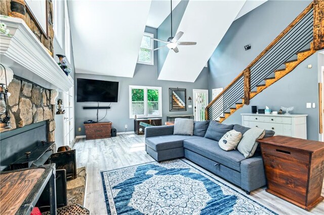 21 Basin Ct, Jasper, GA 30143 - living area featuring high vaulted ceiling, a chandelier, wood finished floors, and a fireplace