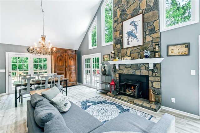 21 Basin Ct, Jasper, GA 30143 - kitchen with a chandelier, light stone counters, white cabinets, a ceiling fan, and a fireplace