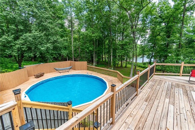 21 Basin Ct, Jasper, GA 30143 - view of swimming pool with a deck and view of wooded area