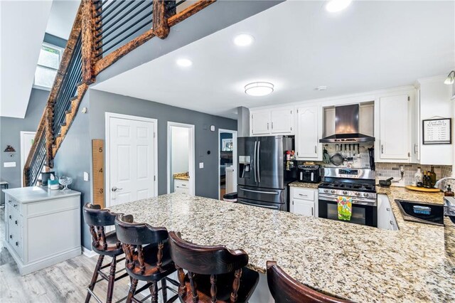 21 Basin Ct, Jasper, GA 30143 - staircase with a stone fireplace and wood finished floors