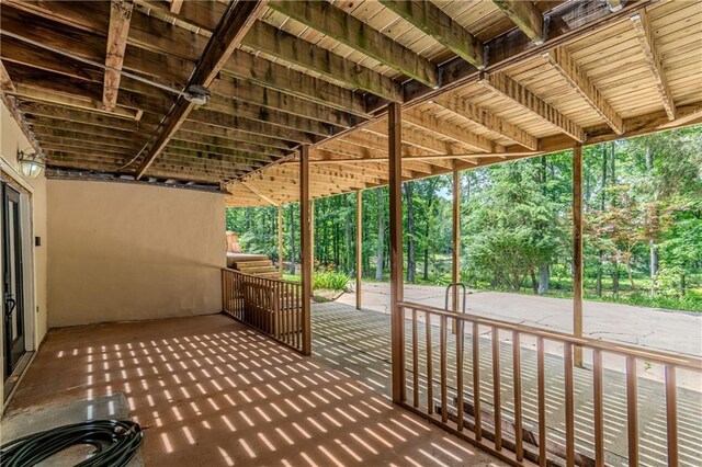 21 Basin Ct, Jasper, GA 30143 - kitchen with a peninsula, a wood stove, wood walls, light countertops, and wooden ceiling
