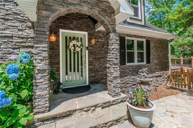 21 Basin Ct, Jasper, GA 30143 - tudor house with a fenced front yard, stone siding, stucco siding, and roof with shingles