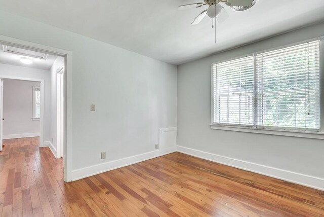 spare room with ceiling fan and hardwood / wood-style flooring