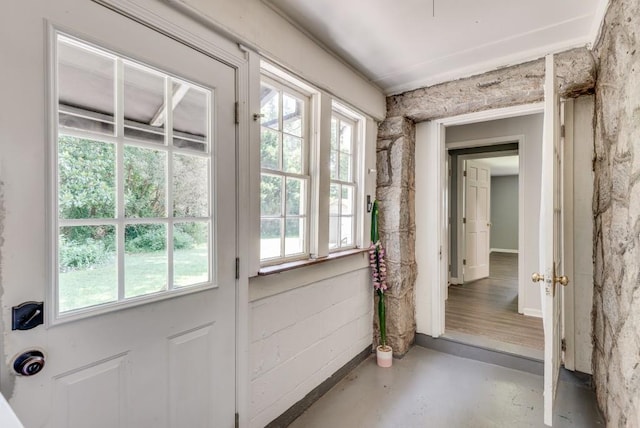 doorway to outside featuring concrete flooring