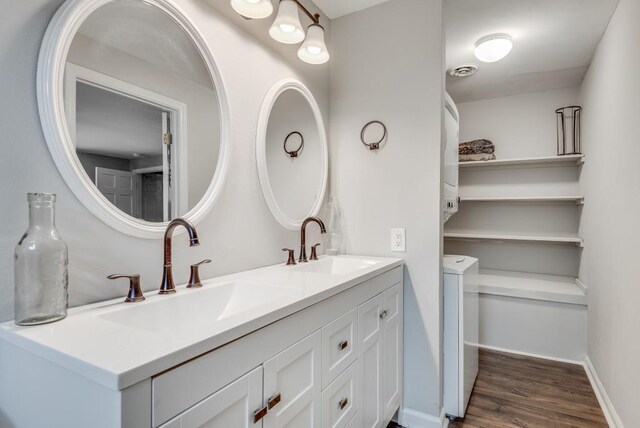 bathroom with vanity and hardwood / wood-style floors