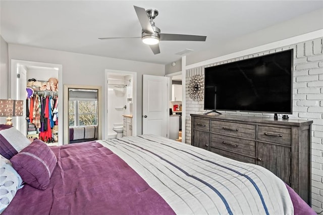 bedroom with visible vents, ceiling fan, a closet, a walk in closet, and connected bathroom