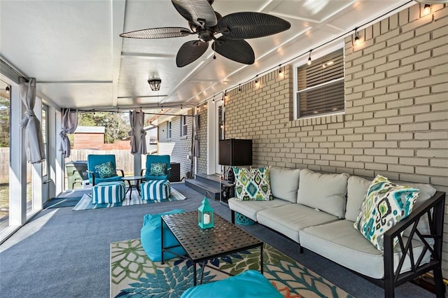 sunroom / solarium with ceiling fan