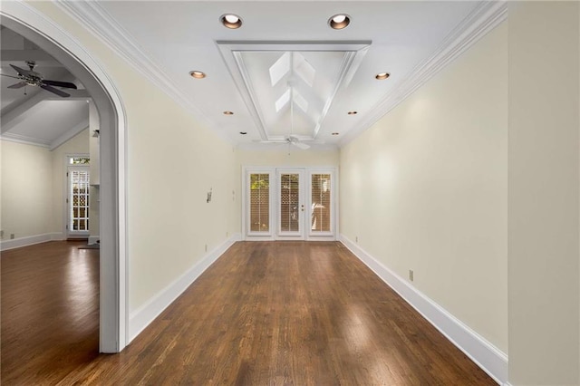 unfurnished room with french doors, dark wood-type flooring, ceiling fan, and crown molding