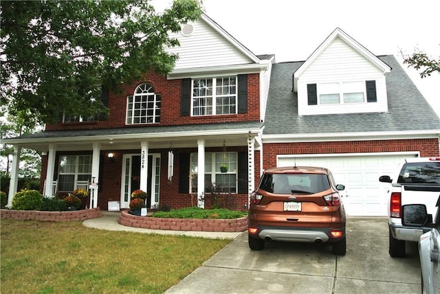 3824 Smith Creek Ct, Buford, GA 30519 - view of front facade featuring brick siding, covered porch, and driveway