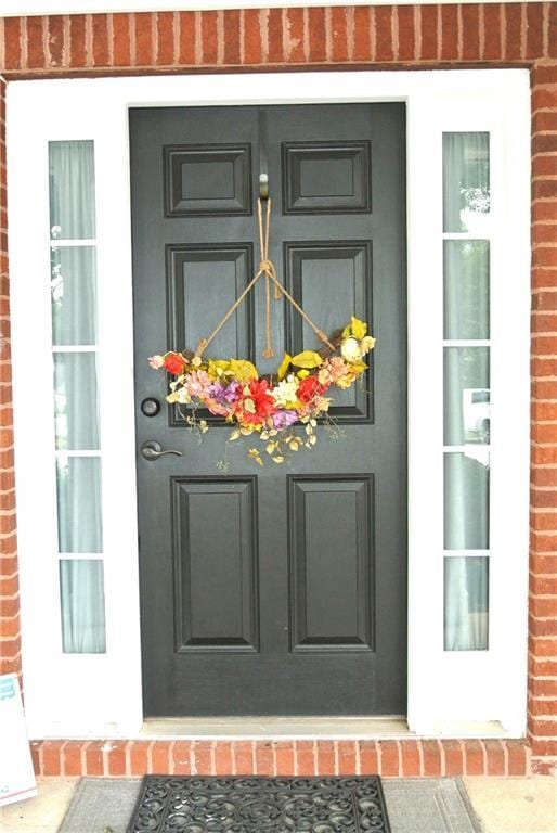 3824 Smith Creek Ct, Buford, GA 30519 - doorway to property featuring brick siding