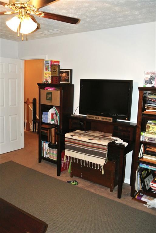 3824 Smith Creek Ct, Buford, GA 30519 - sitting room featuring ceiling fan and carpet flooring