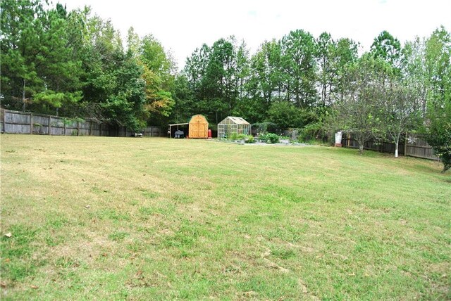 3824 Smith Creek Ct, Buford, GA 30519 - fenced backyard with an outdoor structure and a detached carport