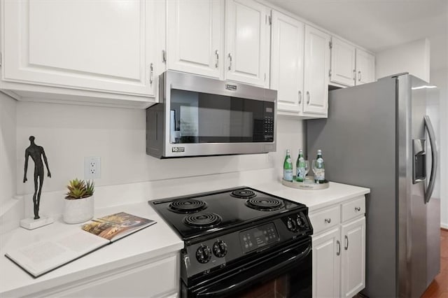 kitchen featuring white cabinetry and appliances with stainless steel finishes