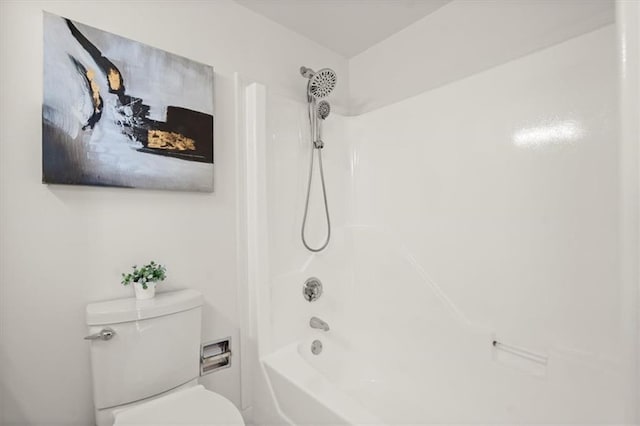 bathroom with shower / bath combination and toilet