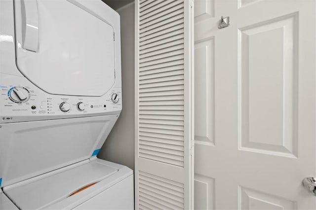 washroom featuring stacked washer and dryer