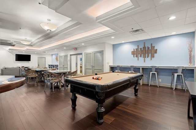 recreation room with a raised ceiling, dark wood-type flooring, and pool table