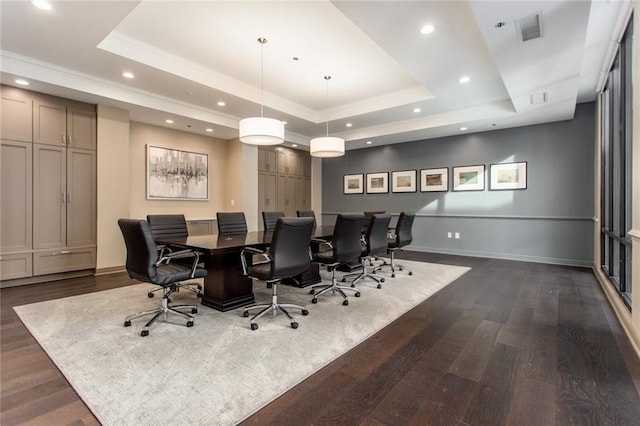 office featuring dark hardwood / wood-style flooring, crown molding, and a tray ceiling