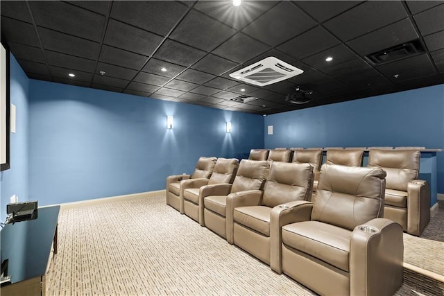 cinema featuring a paneled ceiling and carpet floors