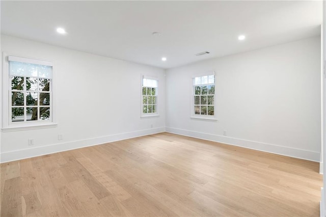 unfurnished room featuring light hardwood / wood-style floors