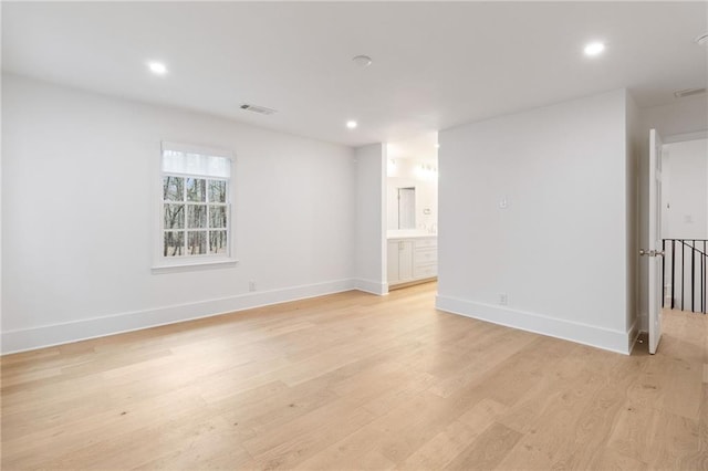 unfurnished room with light hardwood / wood-style flooring