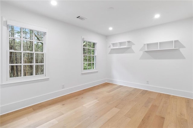 spare room featuring light wood-type flooring