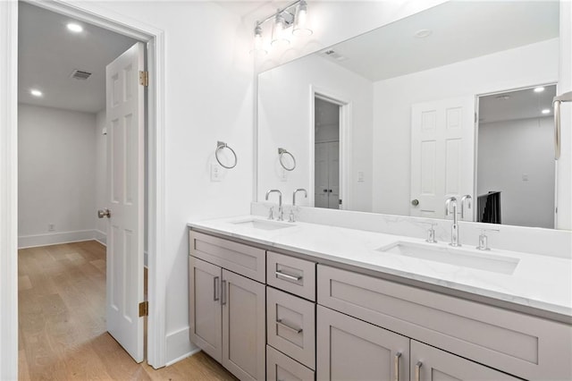 bathroom with vanity and hardwood / wood-style floors