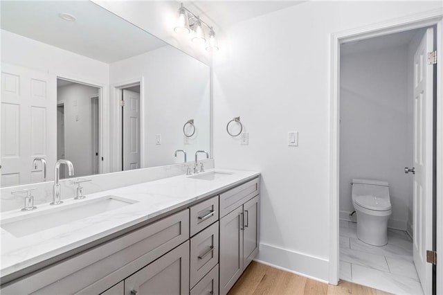 bathroom with vanity and toilet