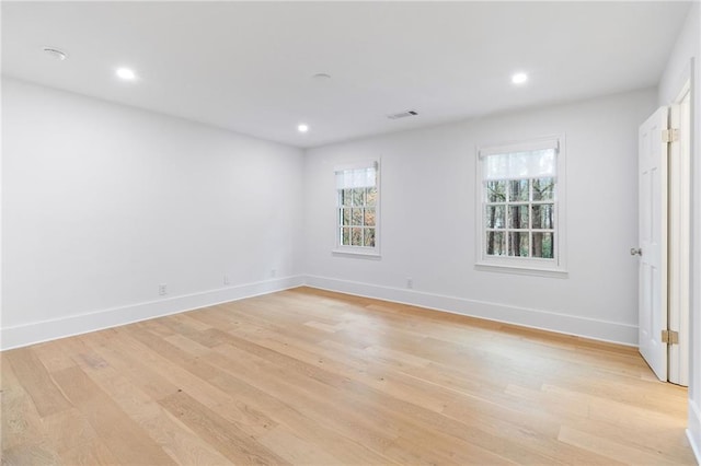 unfurnished room with light hardwood / wood-style flooring