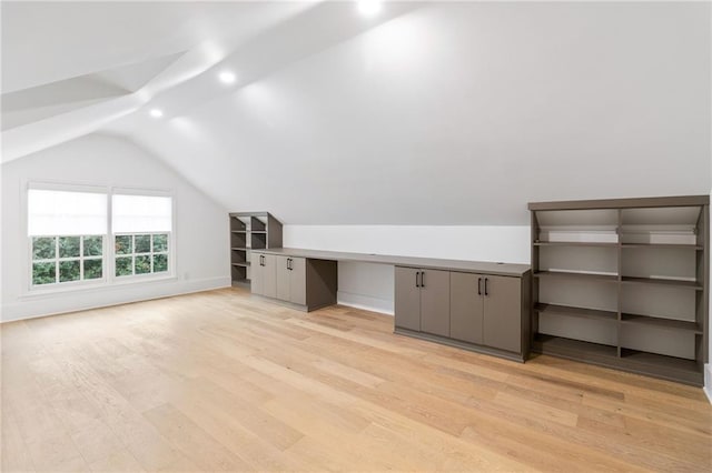 bonus room featuring lofted ceiling and light hardwood / wood-style floors