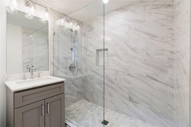 bathroom with vanity and a shower with shower door