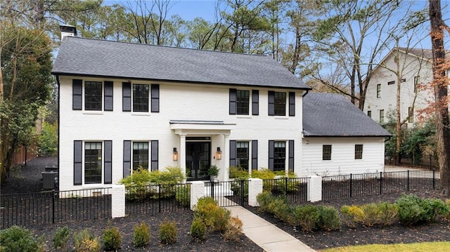 colonial inspired home featuring central air condition unit