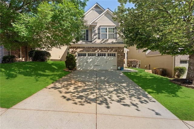 2040 Harvest Ridge Cir, Buford, GA 30519 - view of front of house featuring concrete driveway, a front lawn, and an attached garage
