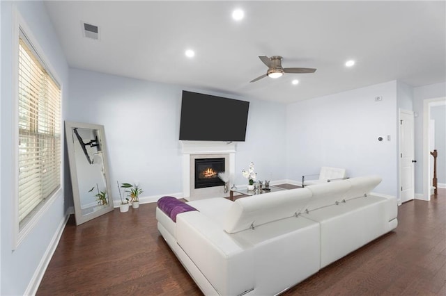 2040 Harvest Ridge Cir, Buford, GA 30519 - living area featuring dark wood finished floors, ceiling fan, a glass covered fireplace, recessed lighting, and baseboards