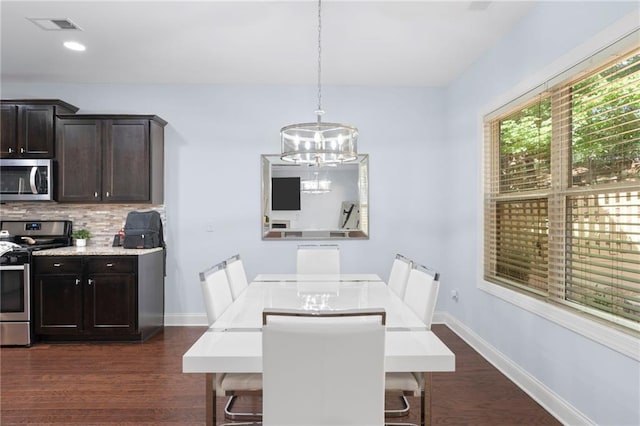 2040 Harvest Ridge Cir, Buford, GA 30519 - dining room with a chandelier, dark wood finished floors, baseboards, and recessed lighting