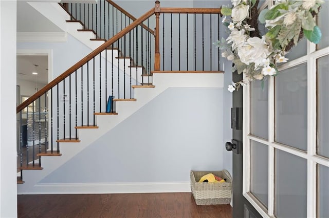2040 Harvest Ridge Cir, Buford, GA 30519 - stairway featuring wood finished floors, crown molding, and baseboards