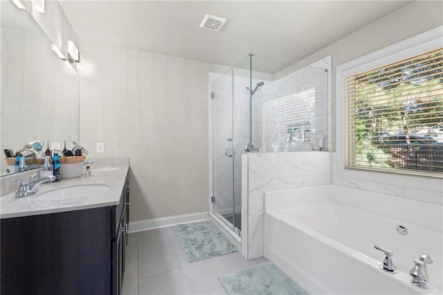 2040 Harvest Ridge Cir, Buford, GA 30519 - full bathroom featuring a garden tub, double vanity, a stall shower, and tile patterned floors