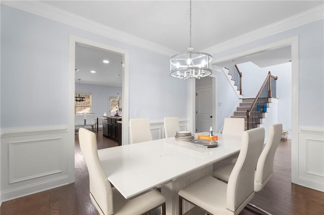 2040 Harvest Ridge Cir, Buford, GA 30519 - dining area featuring a chandelier, dark wood finished floors, stairway, wainscoting, and crown molding